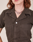 Front close up of Short Sleeve Jumpsuit in Espresso Brown worn by Alex