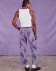 Back view of Paintstamped Work Pants in Grape and Cropped Tank in Vintage Tee Off-White on Jerrod