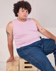 Miguel is wearing Muscle Tee in Lilac and dark wash Carpenter Jeans