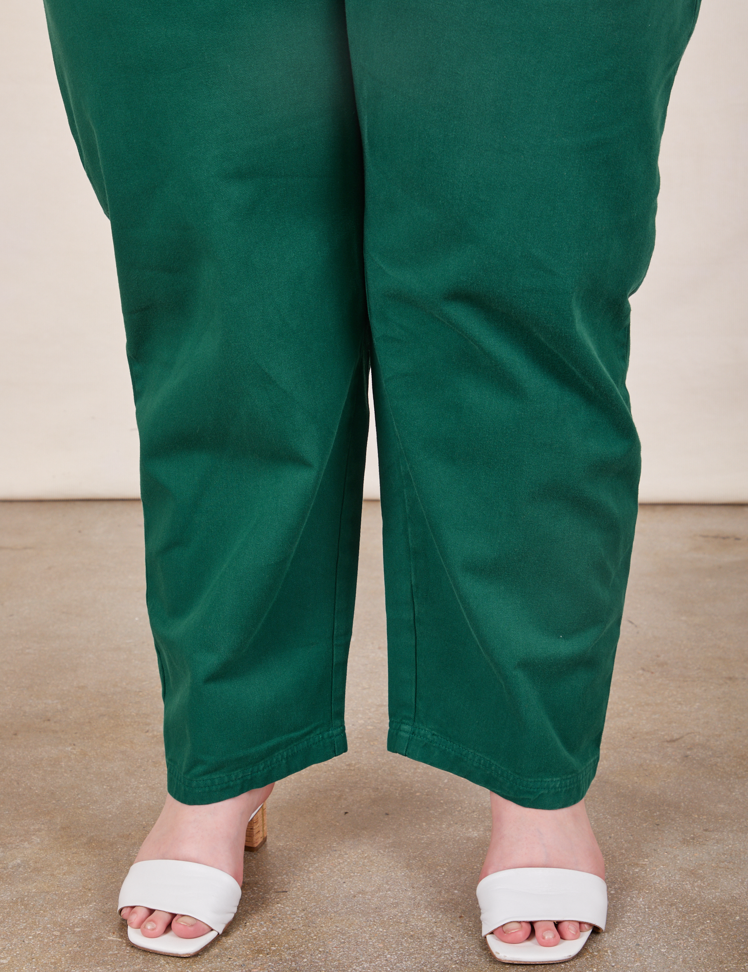 Pant leg close up of Short Sleeve Jumpsuit in Hunter Green worn by Marielena