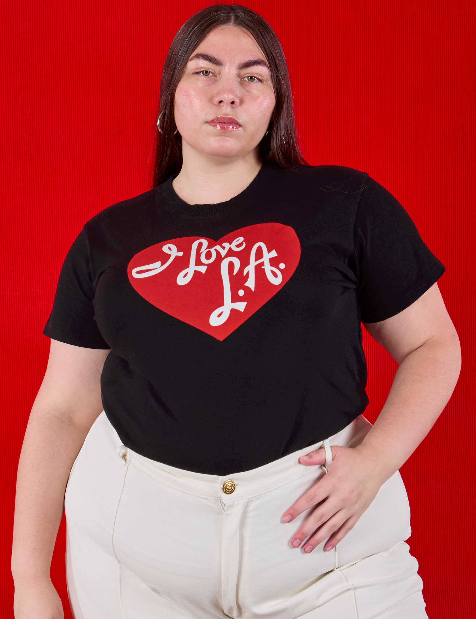 Marielena is wearing I love LA Tourist Tee tucked into vintage tee off-white Western Pants