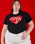 Marielena is wearing I love LA Tourist Tee tucked into vintage tee off-white Western Pants