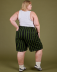 Back view of Longline Work Shorts in Evergreen and vintage tee white Cropped Tank on Juliet