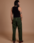 Back view of Black Stripe Work Pants in Evergreen and black Cropped Tank on Anthony