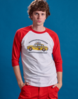 Quinn is 6'3" and wearing M Taxi Raglan Tee in NYC with a yellow taxi graphic