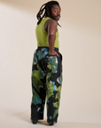 Angled back view of Magic Waters Drop Pocket Pants in Green Pool and gross green Cropped Tank on Demi