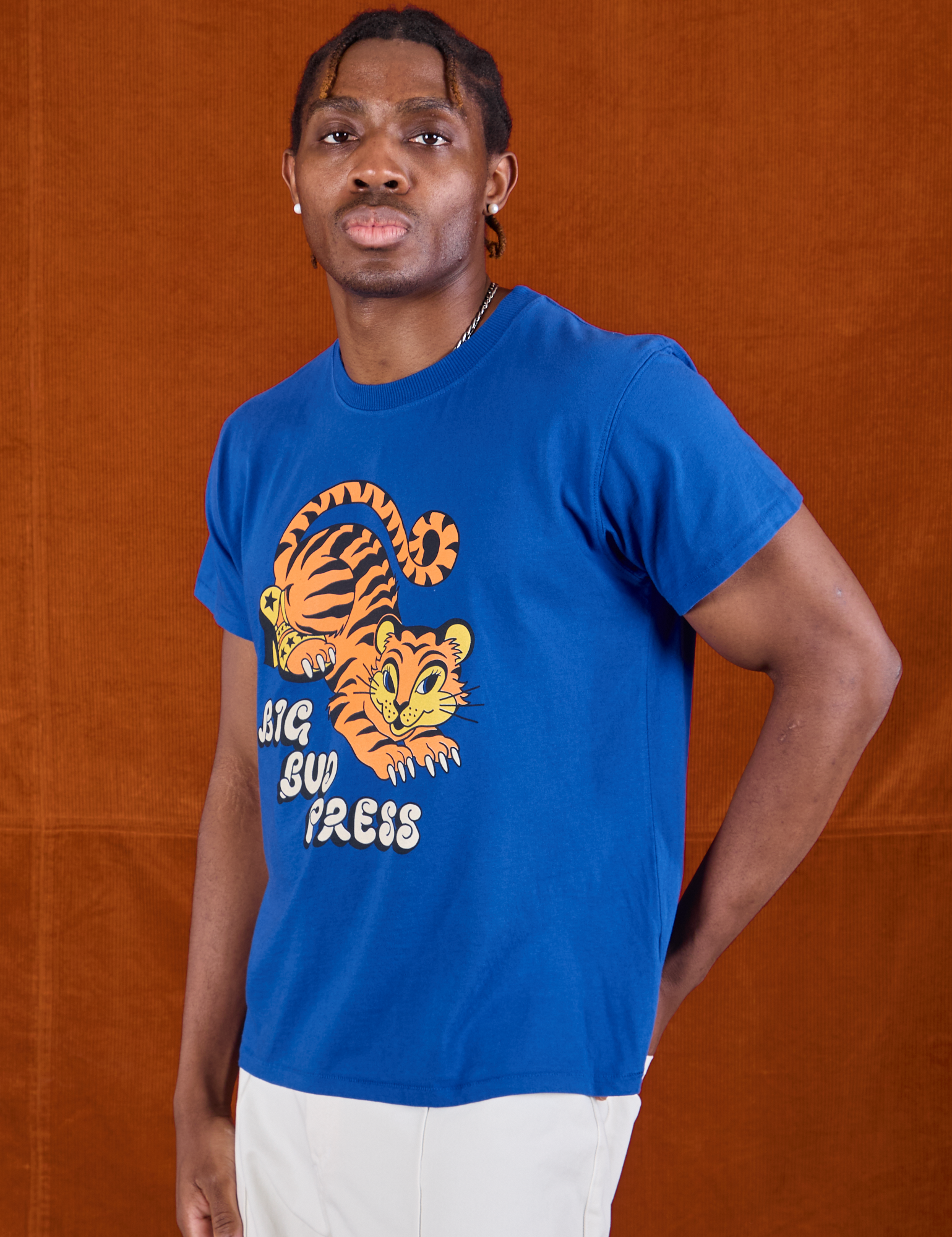 Angled front view of BBP Tiger Tee on Isaac