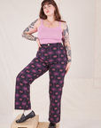 Sydney is wearing Western Pants in Purple Tile Jacquard and bubblegum pink Cami