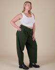 Angled front view of Heavyweight Trousers in Swamp Green and Cropped Tank in Vintage Tee White on Lish