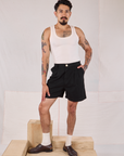 Jesse is 5’8” and wearing XS Trouser Shorts in Basic Black paired with a Tank Top in vintage tee off-white