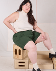 Trouser Shorts in Swamp Green and Sleeveless Turtleneck in vintage tee off-white on Ashley