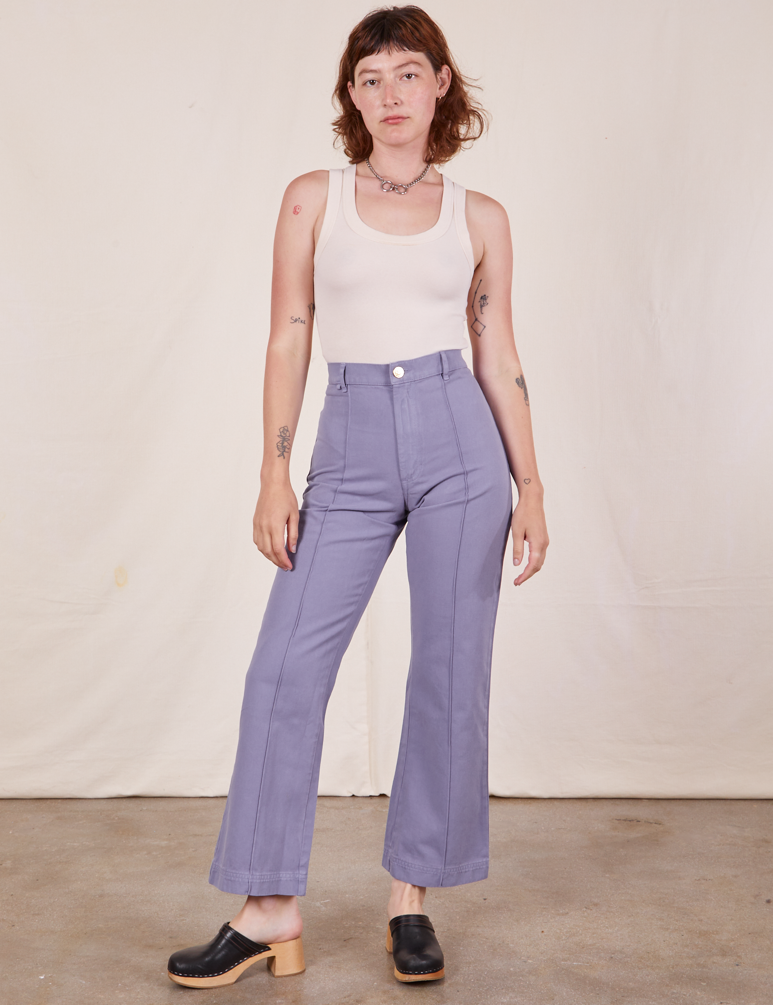 Alex is 5'8" and wearing XS Western Pants in Faded Grape paired with vTank Top in intage tee off-white