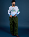 Jesse is wearing Floral Long Sleeve Baby Tee in Baby Blue and evergreen Drop Pocket Cargo Pants