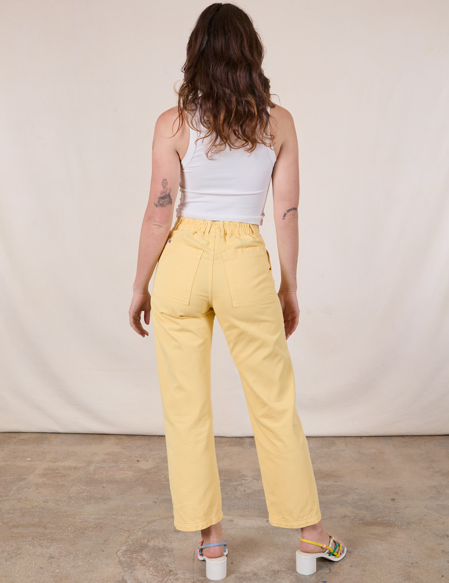 Work Pants in Butter Yellow back view on Alex