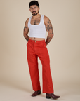 Jesse is 5’8” and wearing S Work Pants in Mustang Red paired with a vintage tee white Cropped Tank