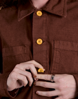 Front close up of Ripstop Field Coat in Fudgesicle Brown on Alex