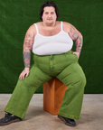 Sam is wearing Overdyed Wide Leg Trousers in Gross Green and Cropped Cami in vintage tee off-white