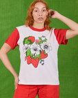 Tiara is 5’4” and wearing XS Anniversary Tee in Strawbaby