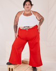 Sam is 5'10" and wearing 3XL Bell Bottoms in Mustang Red paired with Halter Top in vintage tee off-white