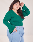 Side view of Bell Sleeve Top in Hunter Green and light wash Trouser Jeans worn by Ashley