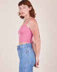 Side view of Cropped Cami in Bubblegum Pink and light wash Frontier Jeans worn by Alex