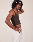 Side view of Cropped Cami in Espresso Brown and vintage tee off-white Western Pants worn by Jerrod