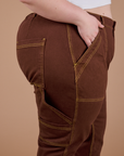 Carpenter Jeans in Fudgesicle Brown side view close up on Ashley