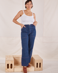 Tiara is wearing Carpenter Jeans in Dark Wash and Cropped Cami in vintage tee off-white