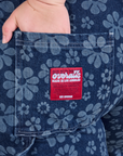 Close up of Ashley's hand in the back pocket of Carpenter Overalls in Lazy Daisy