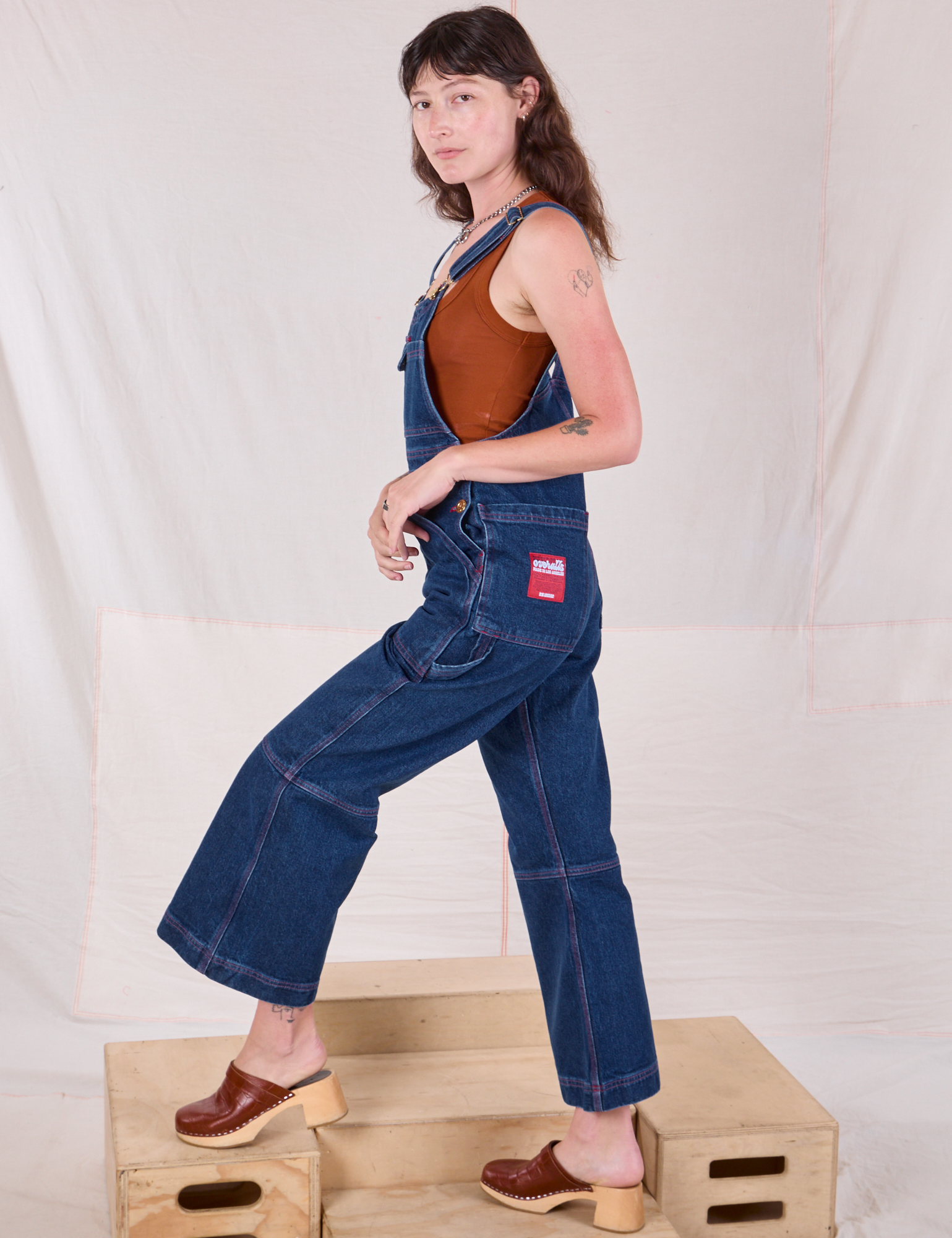 Side view of Carpenter Overalls in Dark Wash on Alex