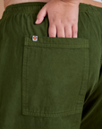 Close up of Juliet's hand tucked into back pocket of Drop Pocket Cargo Pants in Evergreen
