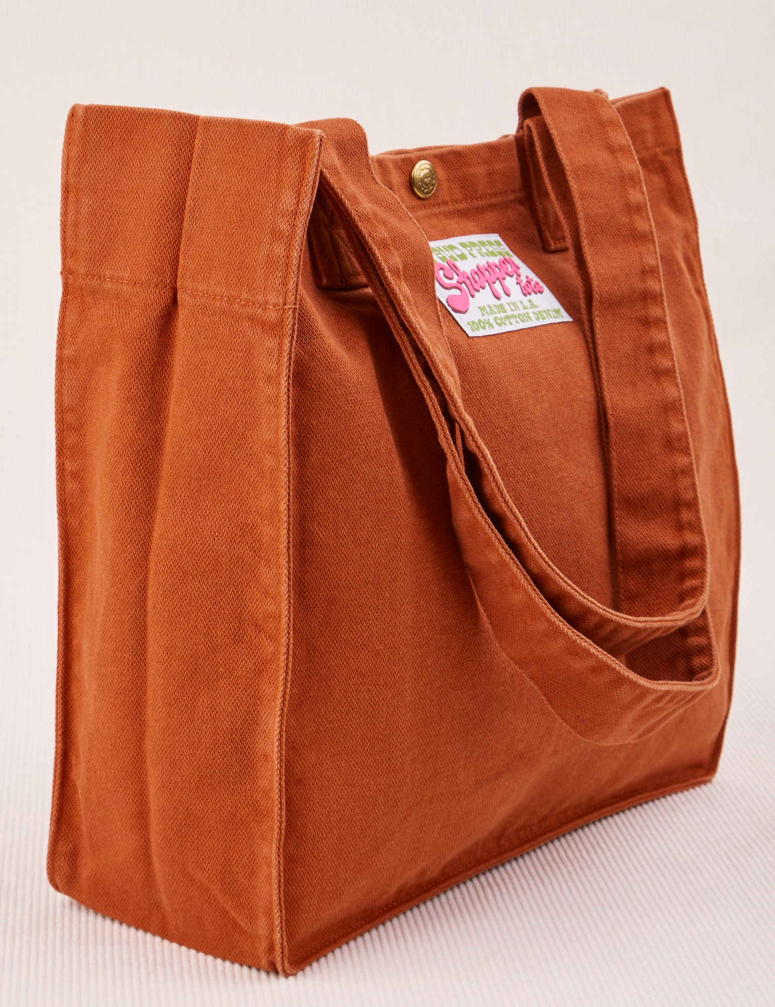 Angled view of Shopper Tote in Burnt Terracotta