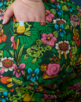 Close up of Ashley's hand in the back pocket of Pond Party Print Jumpsuit