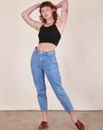 Alex is wearing Halter Top in Basic Black and light wash Frontier Jeans