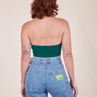 Back view of Halter Top in Hunter Green and light wash Frontier Jeans worn by Alex