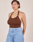 Tiara is wearing Halter Top in Fudgesicle Brown and light wash Sailor Jeans