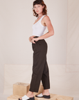 Side view of Heavyweight Trousers in Espresso Brown and Cropped Tank Top in vintage tee off-white worn by Alex