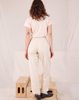 Back view of Heritage Trousers in Natural  and Organic Vintage Tee in vintage tee off-white on Alex
