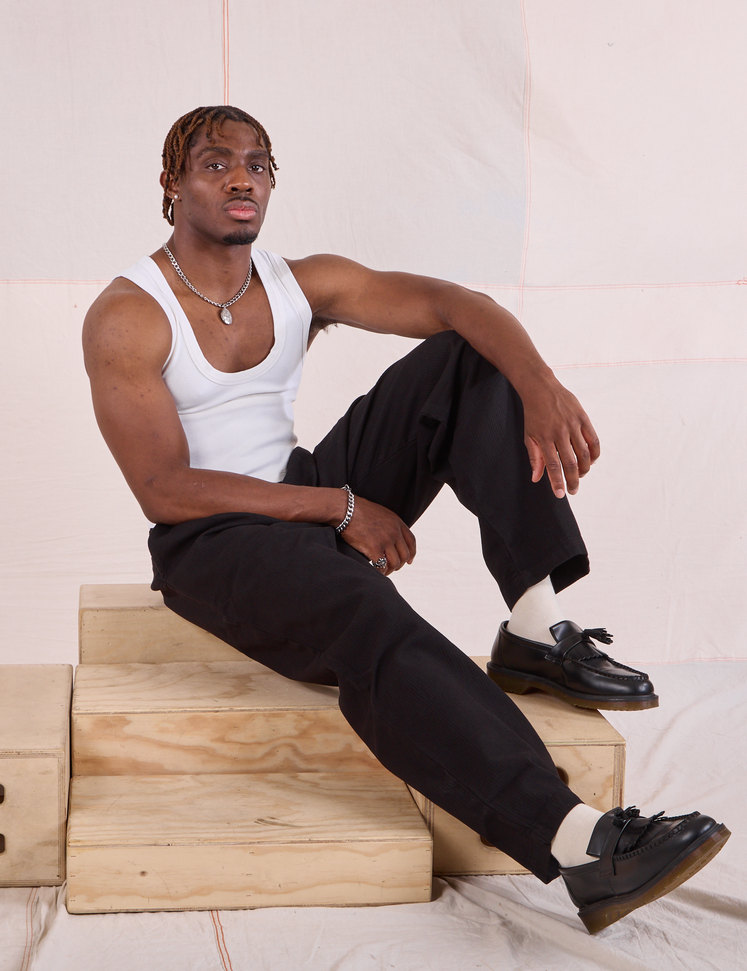 Issac is wearing Heritage Trousers in Basic Black