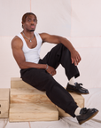 Issac is wearing Heritage Trousers in Basic Black