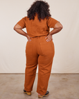 Back view of Short Sleeve Jumpsuit in Burnt Terracotta worn by Morgan