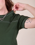 JV Tee in Swamp Green shoulder close up on Alex
