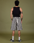 Back view of Longline Work Shorts in Natural and black Cropped Tank on Jesse