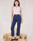Alex is wearing Muscle Tee in Vintage Tee Off-White and dark wash Carpenter Jeans