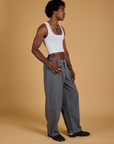 Angled front view of Baggy Mid-Rise Trousers in Slate Grey and vintage tee white on Jerrod