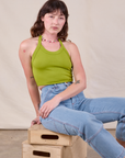 Halter Top in Gross Green and light wash Carpenter Jeans worn by Alex