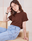 Hana is wearing Organic Vintage Tee in Fudgesicle Brown and light wash Carpenter Jeans