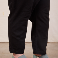 Side view pant leg close up of Original Overalls in Mono Black on Catie