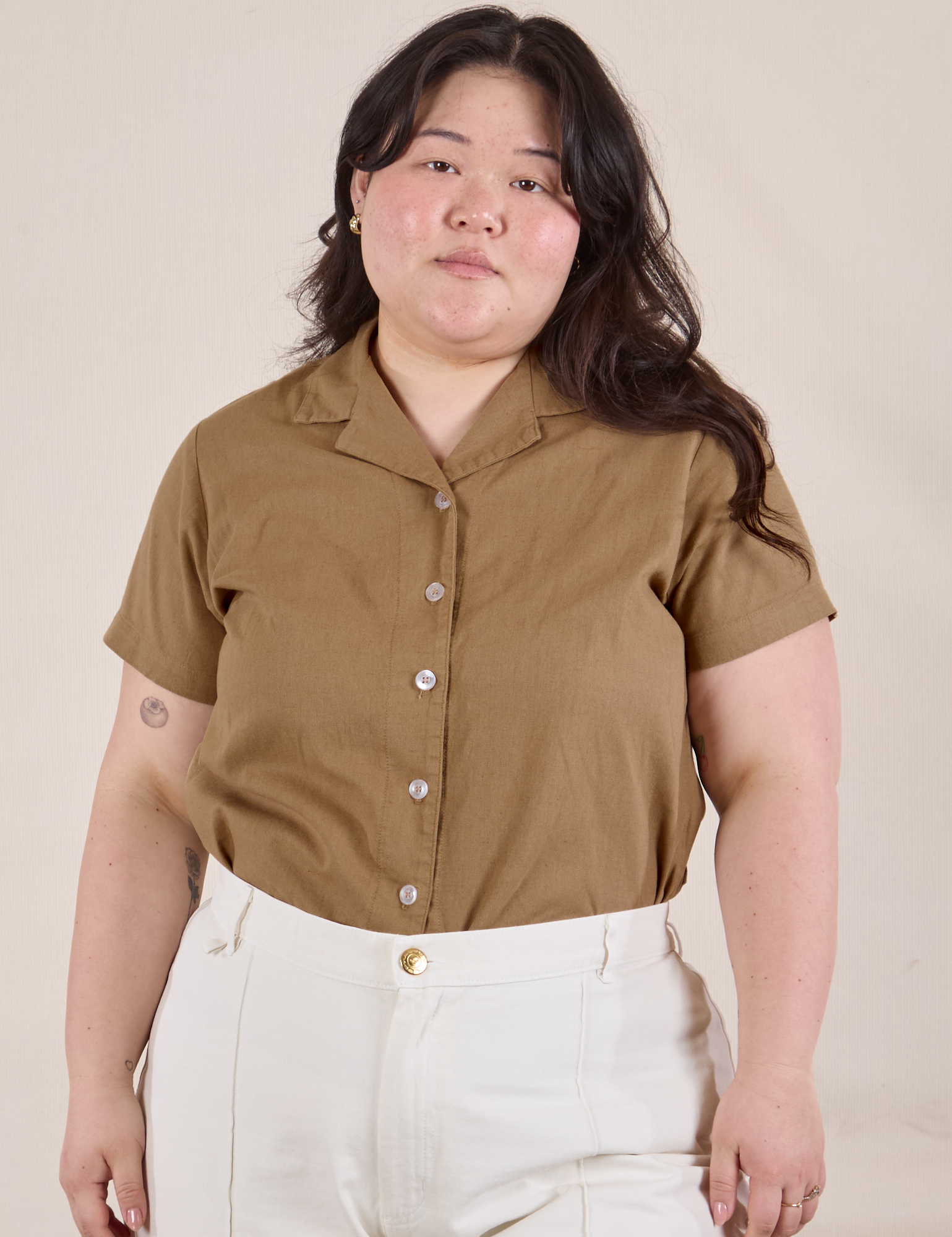 Ashley has Pantry Button-Up in Desert Brown tucked into vintage tee off-white Western Pants
