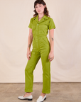 Short Sleeve Jumpsuit in Gross Green angled front view on Alex